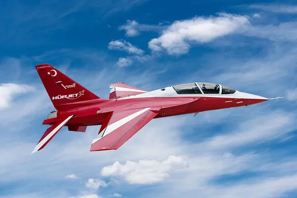Red and white TAI Hürjet jet trainer in flight